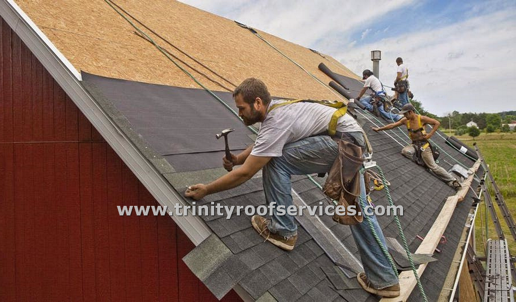 Picture of Doyle installing gutter on a home in Yulee, FL